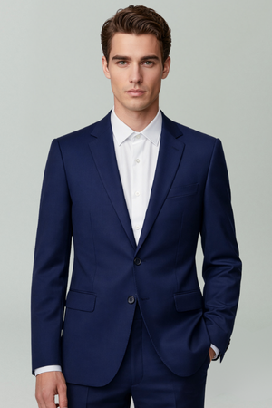 Man wearing a blue suit and white shirt on a gray background